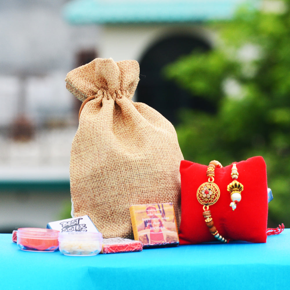 Bhaiya Bhabhi Fancy Rakhi Lumba Combo with Chocolates Potli